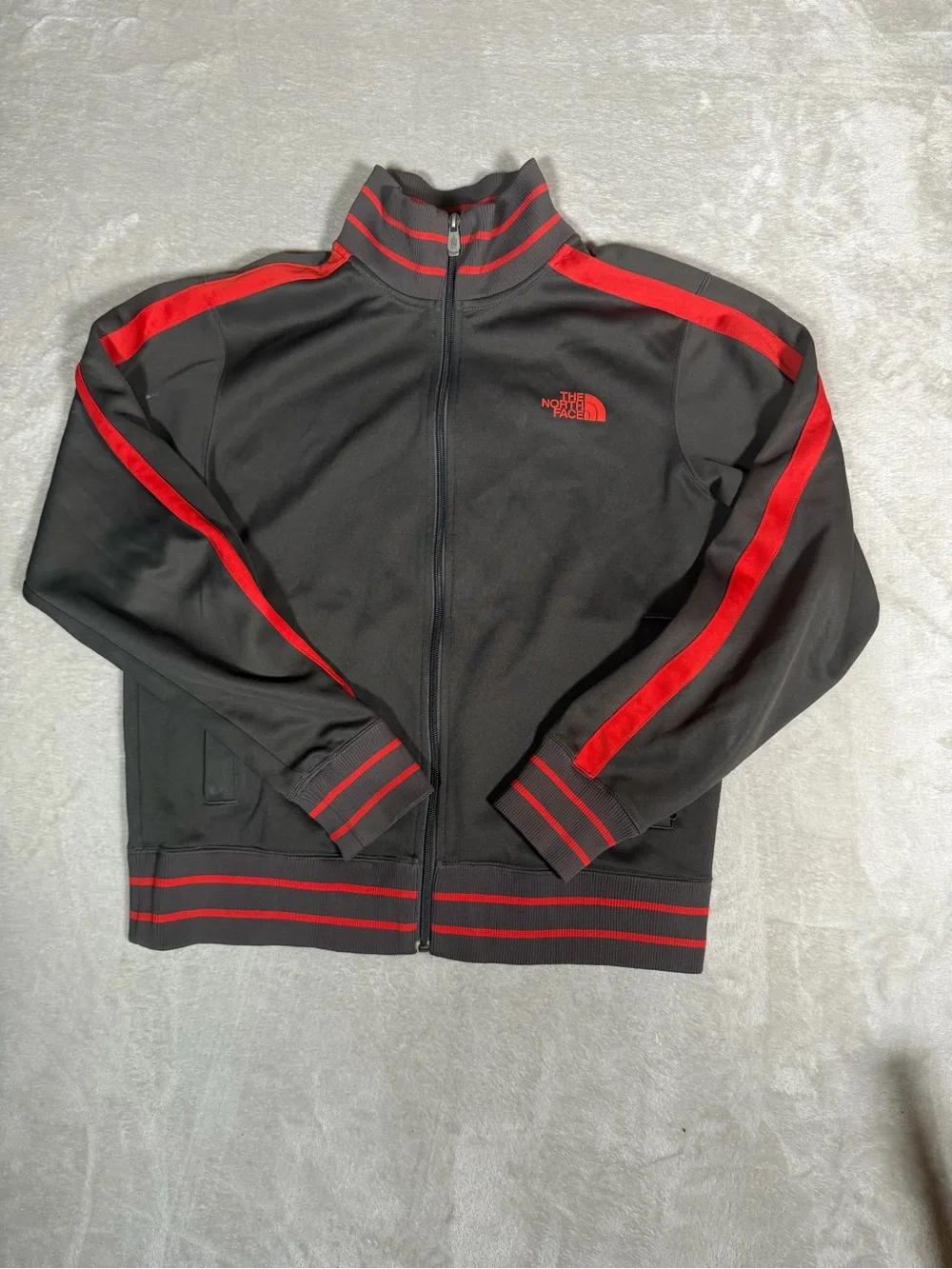 The North Face Black Jacket with Red Stripe Accents